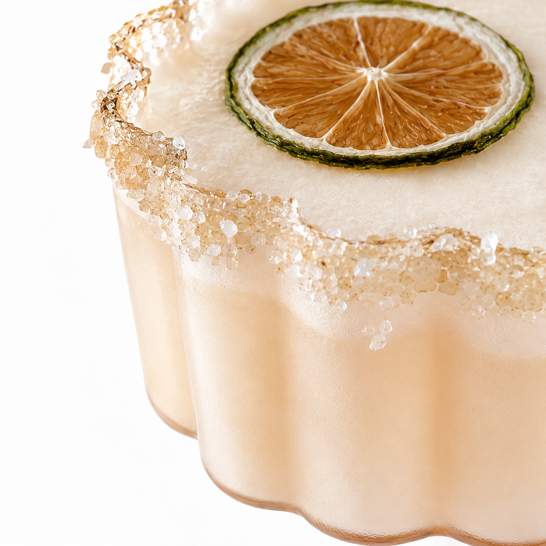 Cocktail with a lime, salty, sweet rim blend and dried lime garnish on a white background